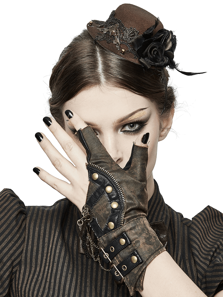 Stylish woman in steampunk leather gloves with rivets, showcasing a chic look with a brown hat and retro outfit.
