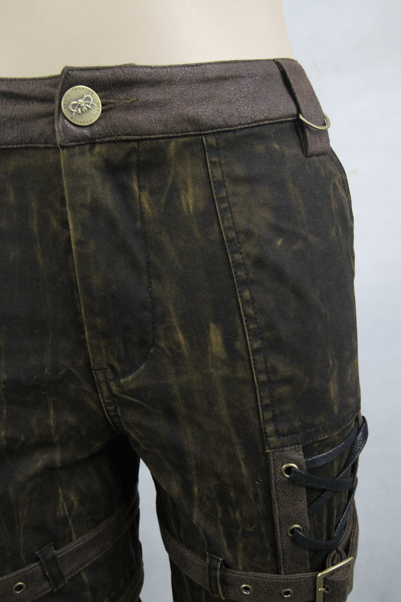 Close-up of stylish steampunk brown cotton trousers featuring decorative buckles and a tight-fitting cut.