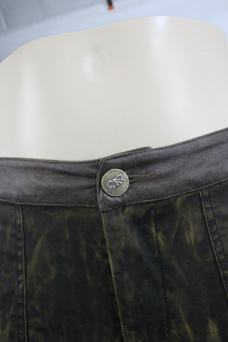 Detail shot of steampunk brown trousers showcasing the button closure and waistband design.