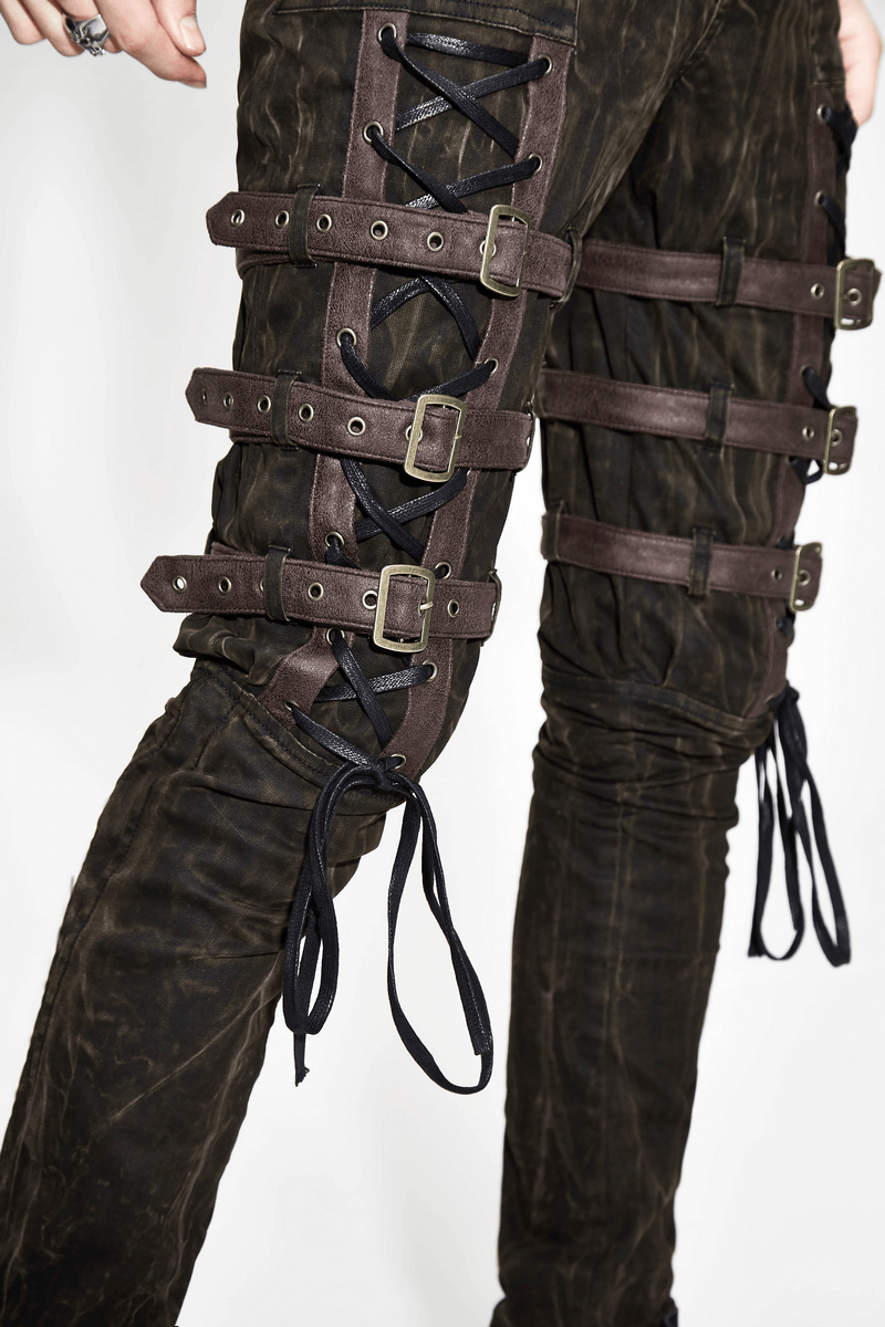 Close-up of steampunk brown cotton trousers featuring stylish buckles and lace-up details.