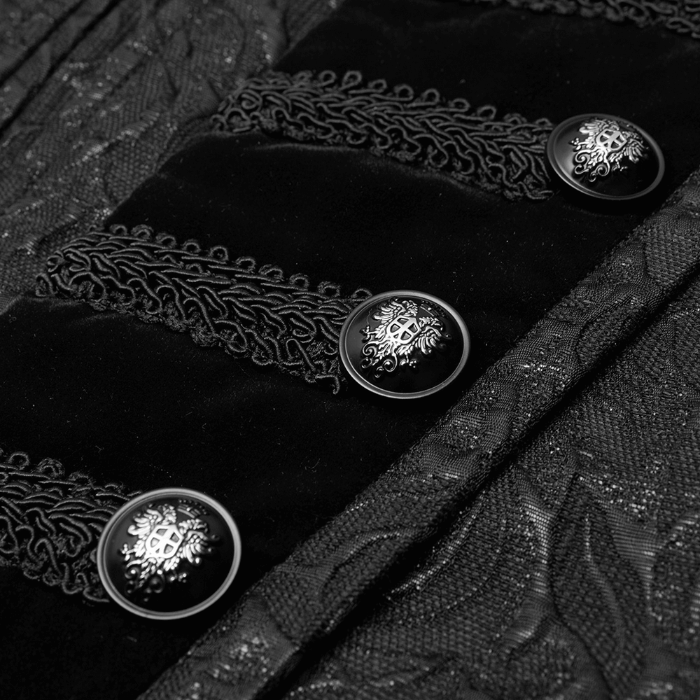 Close-up of black embroidered velvet waistcoat with ornate buttons and floral patterns, showcasing steampunk elegance.