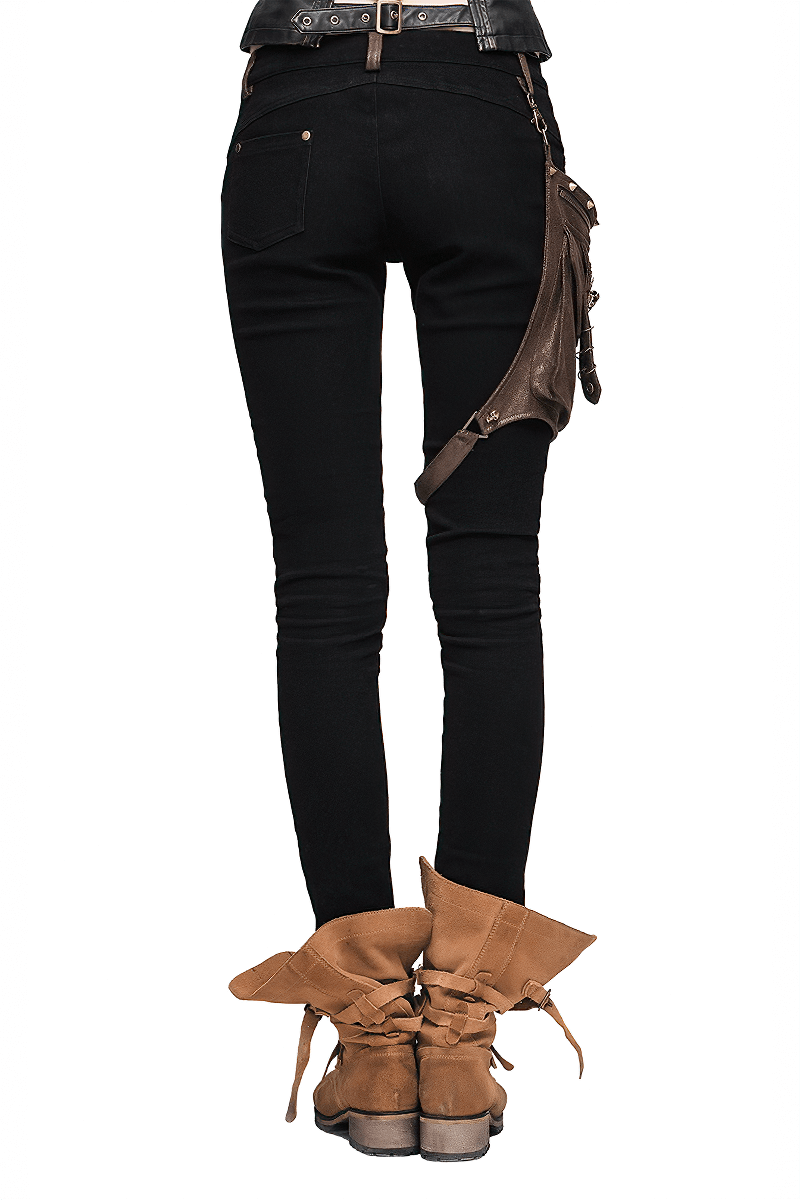 Back view of women's black steampunk pants with leather pocket, paired with stylish brown boots.