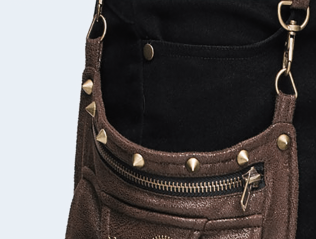 Close-up of stylish brown leather pocket with studs on women's steampunk pants.