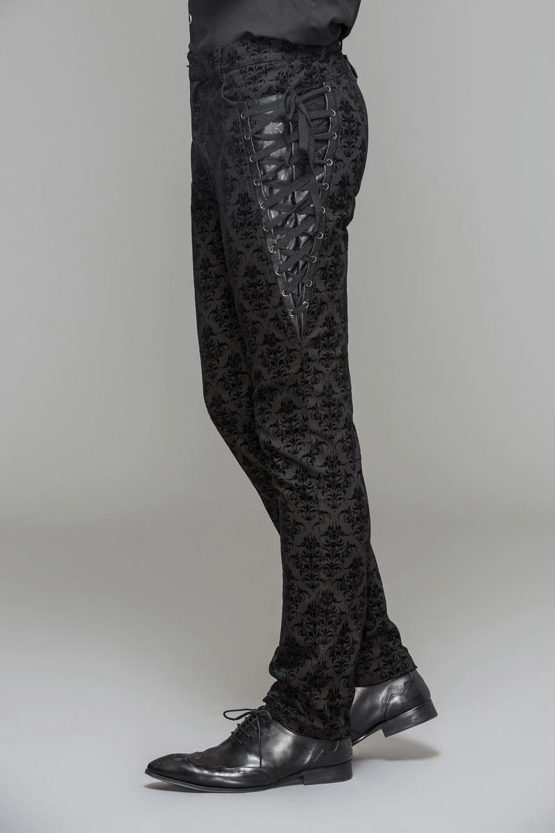 Gothic black slim pants with lace-up sides, showcasing elegant vintage print and fitted cut for a stylish look.