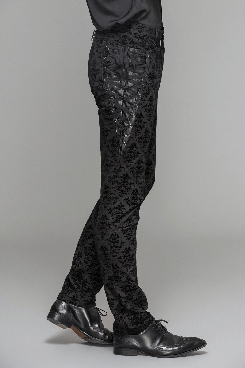 Men's black slim pants with gothic lace up sides and vintage print, perfect for a steampunk-inspired wardrobe.