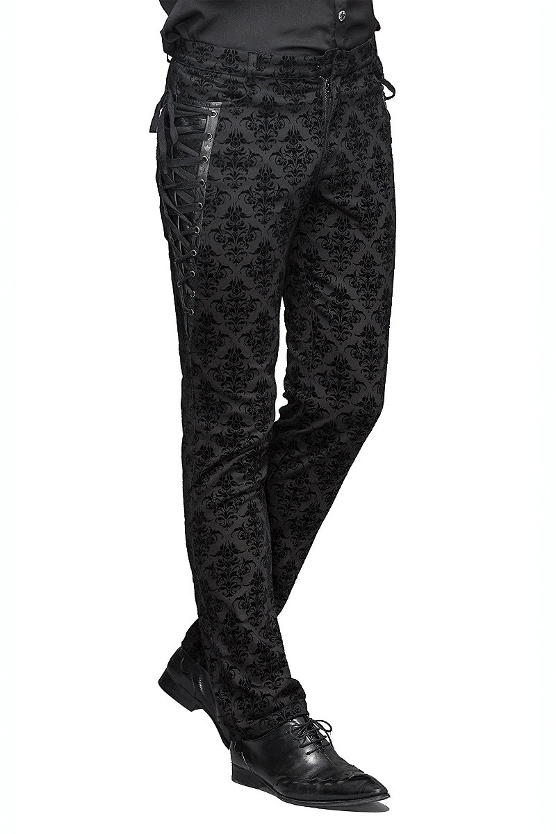 Gothic black slim pants with vintage print and lace-up sides for a stylish steampunk look.