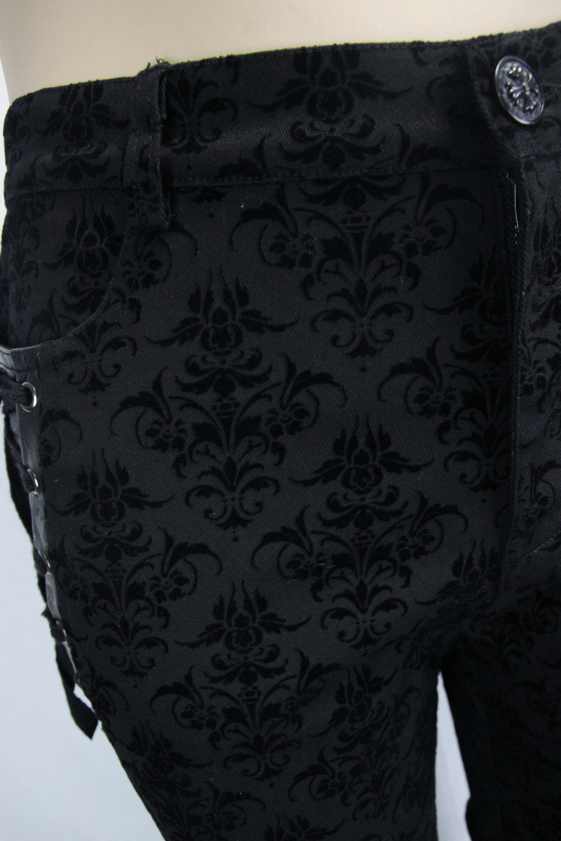 Gothic black slim pants with elegant vintage print and lace-up sides, perfect for a stylish, steampunk look.