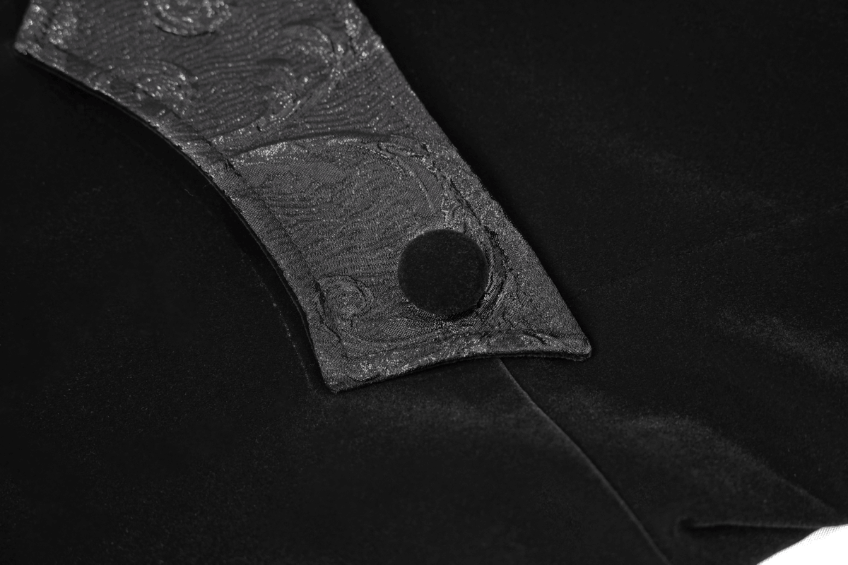 Close-up of the ornate collar detail on a black velvet steampunk coat with a button.