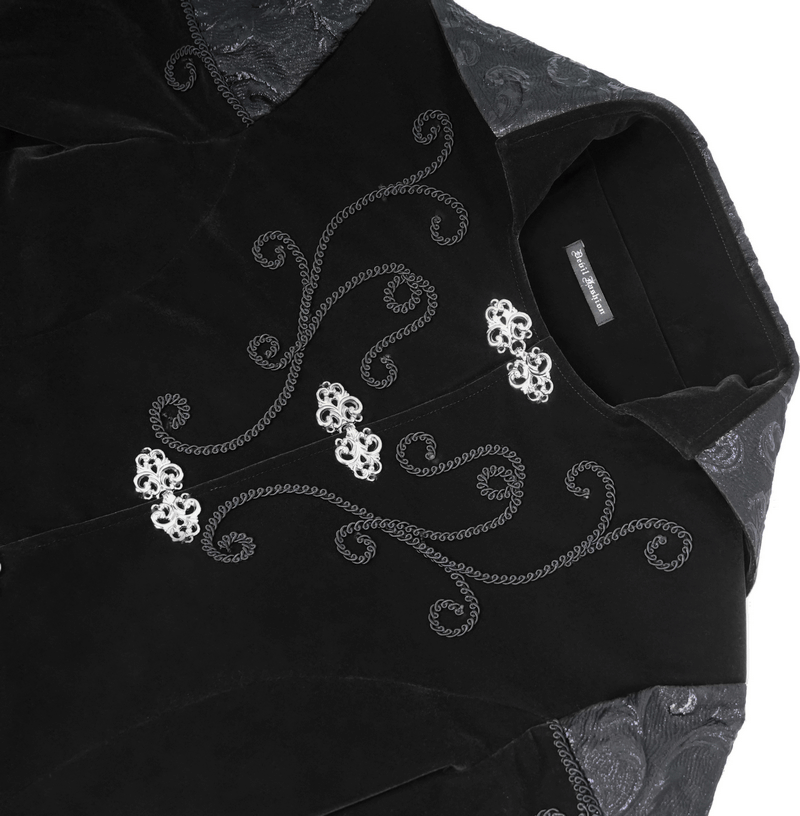 Close-up of a steampunk black velvet coat featuring elegant silver button details and intricate embroidery design.