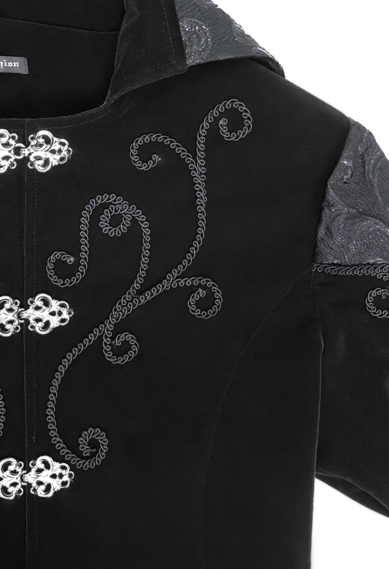 Close-up of a black velvet steampunk coat with intricate silver button detailing and embroidered patterns.