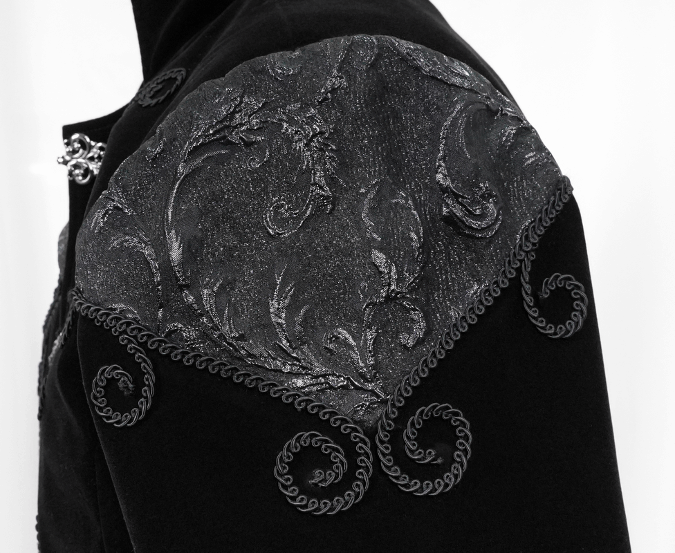 Close-up of a vintage steampunk men's black velvet coat with intricate embroidered shoulder detailing.
