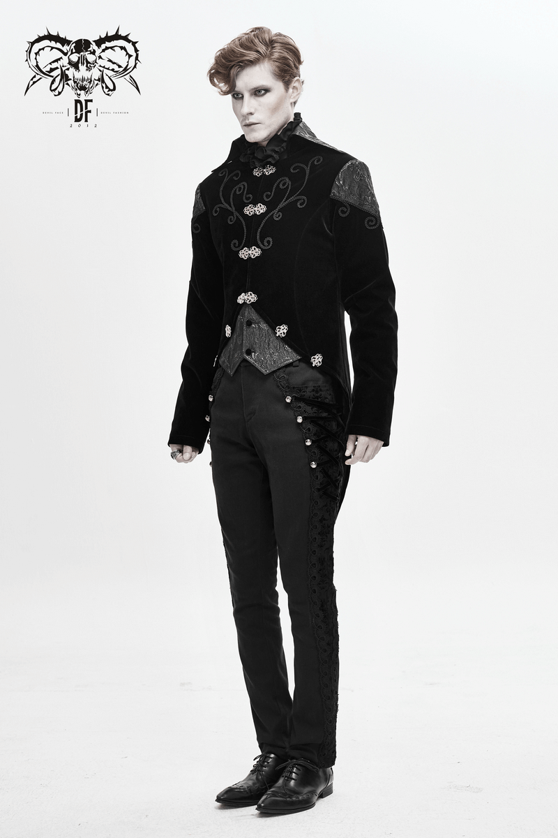 Stylish man in a vintage steampunk black velvet coat with silver buttons and fitted pants.