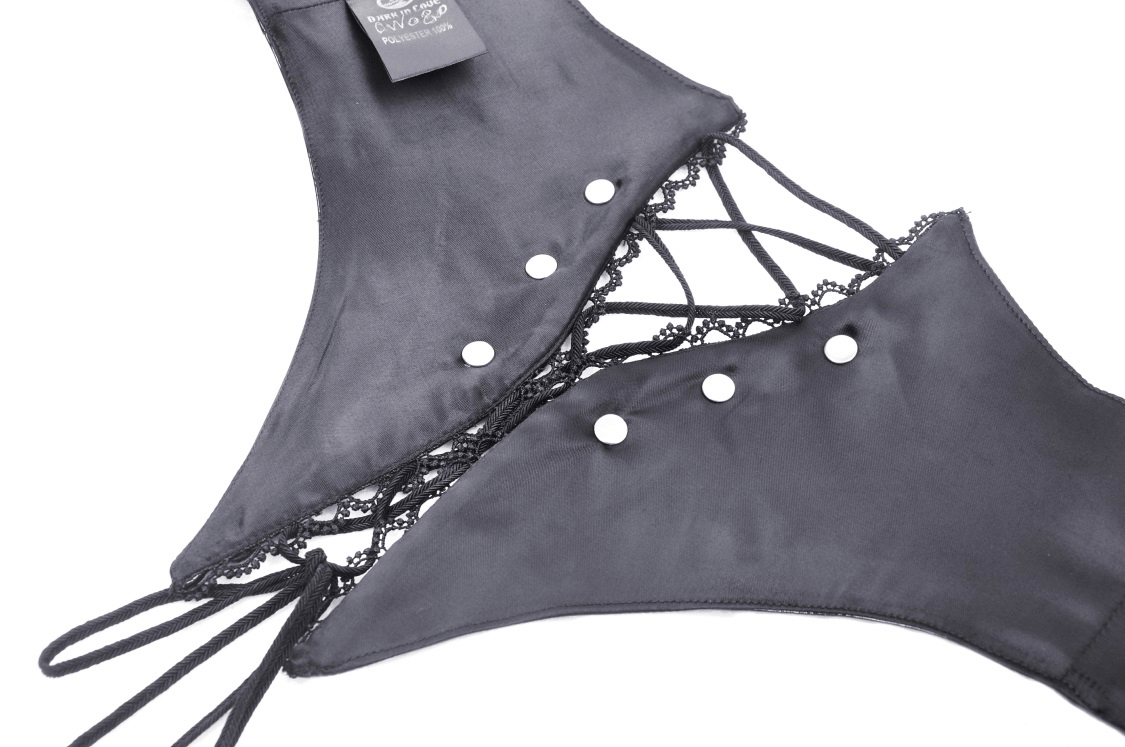 Close-up of a black lace-up corset belt with grommets and straps, showcasing its edgy, gothic design.