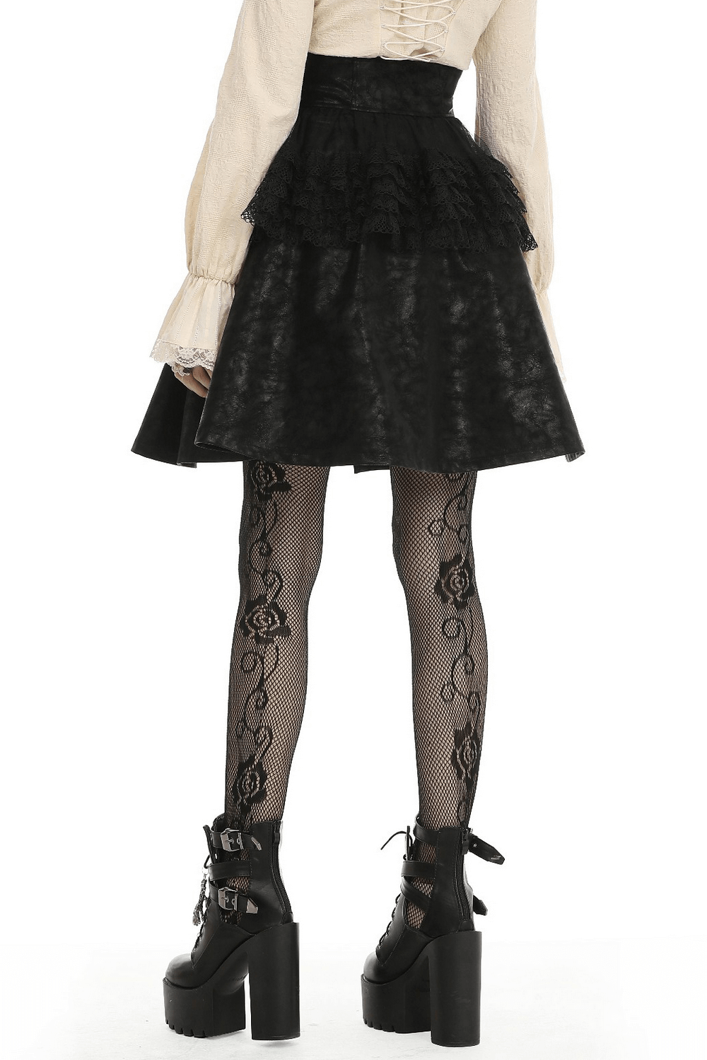 Back view of a steampunk PU leather skirt with lace, paired with fishnet stockings and chunky boots.