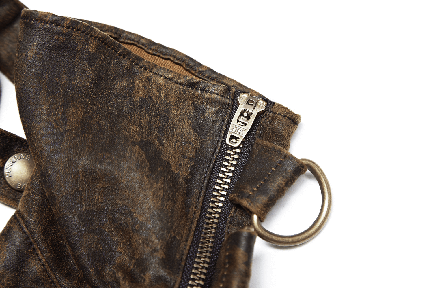 Close-up of steampunk PU zip cuff glove showcasing distressed leather, zippers, and metal accents.