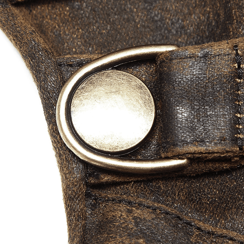 Close-up of a metal buckle on a steampunk-style glove, showcasing its rugged, industrial design.