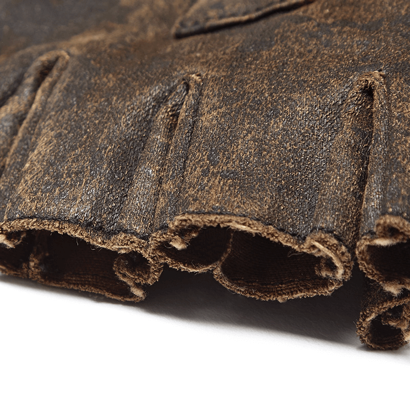 Close-up of distressed PU leather texture with ruffled edges, showcasing steampunk style gear accents.