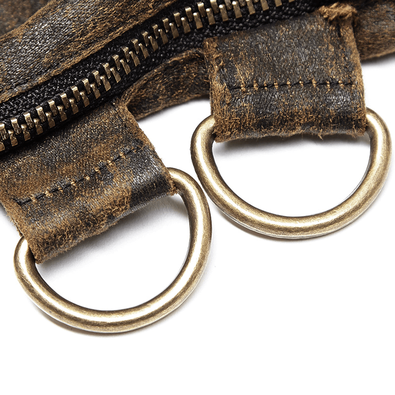 Close-up of steampunk zip cuff detail with metal buckles and rings, showcasing distressed faux leather texture.