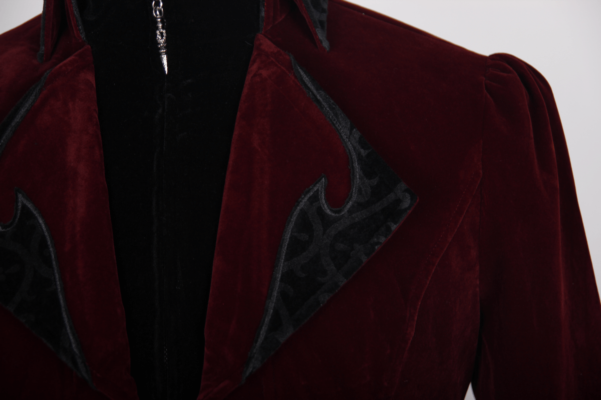 Close-up of a steampunk male burgundy velvet coat showcasing luxurious fabric and stylish black accents.