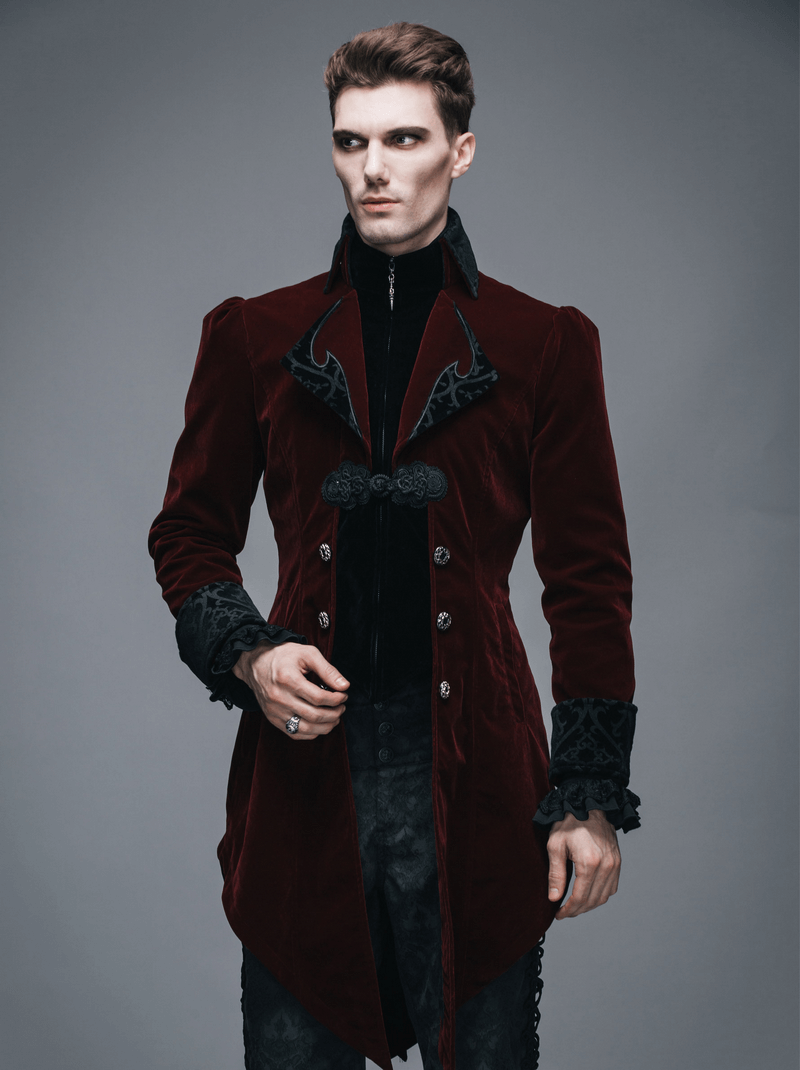 Stylish male model wearing a burgundy velvet steampunk coat with gothic details and retro buttons.
