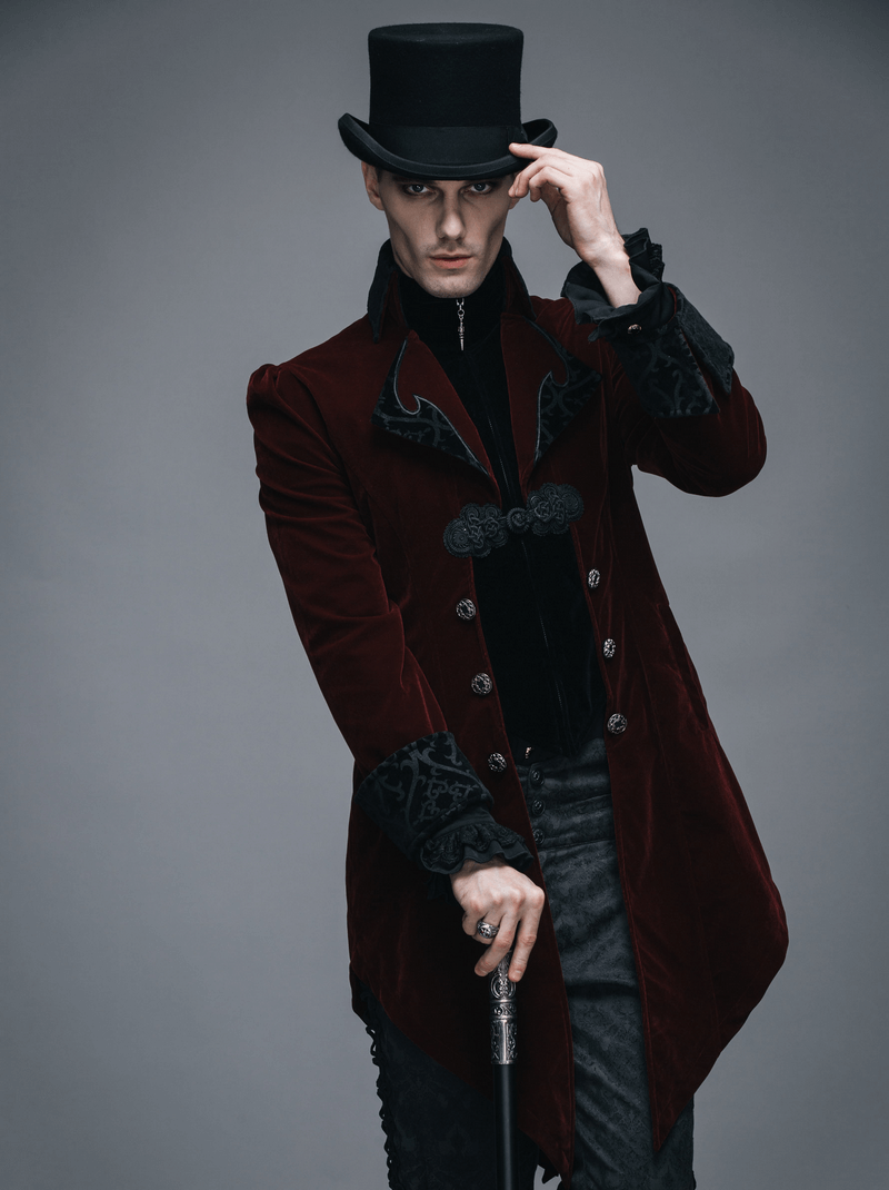 Steampunk male model in burgundy velvet coat and top hat, showcasing gothic style and vintage elegance.