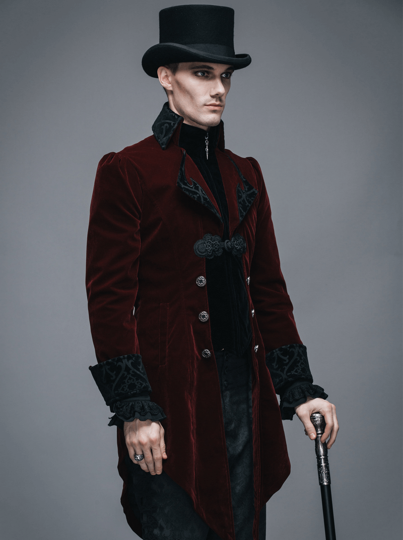 Stylish man in a burgundy velvet steampunk coat with vintage details and top hat, showcasing gothic fashion.