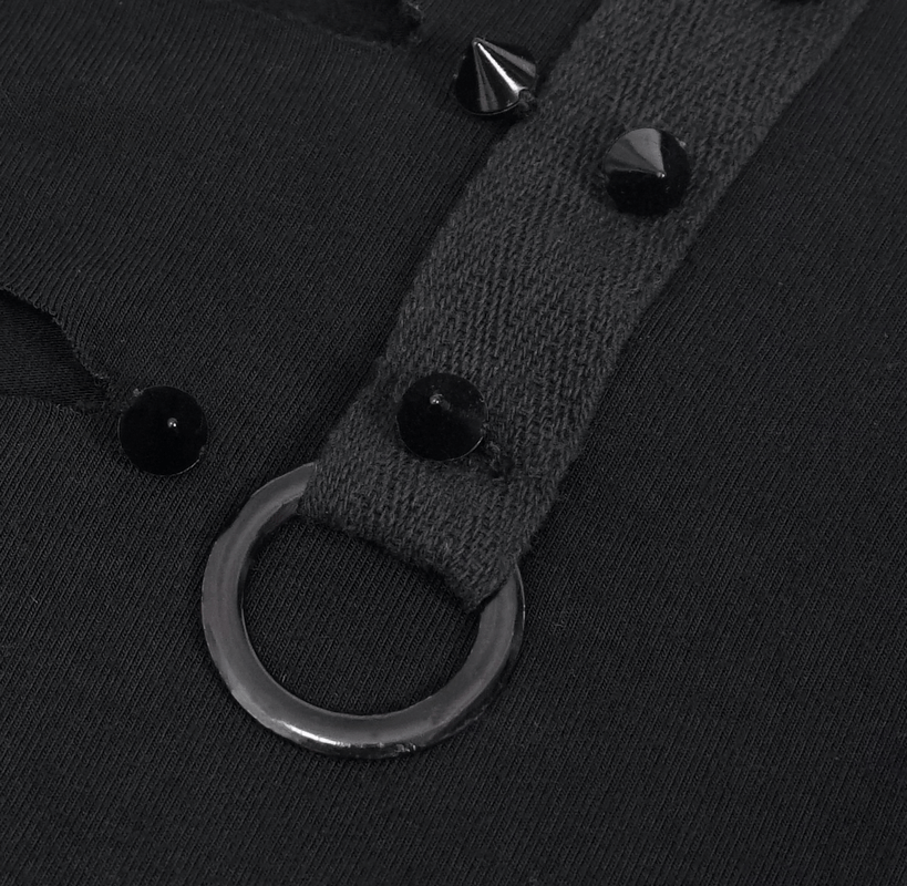 Close-up of black tank top with spikes and decorative metal ring detail, showcasing steampunk style.