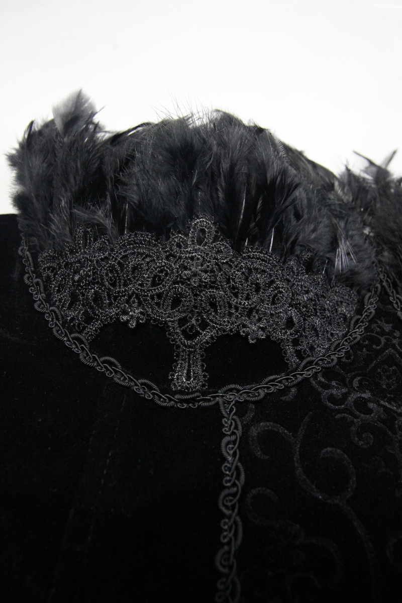 Close-up of lace and feather detail on a black gothic strapless dress, showcasing elegant steampunk style.