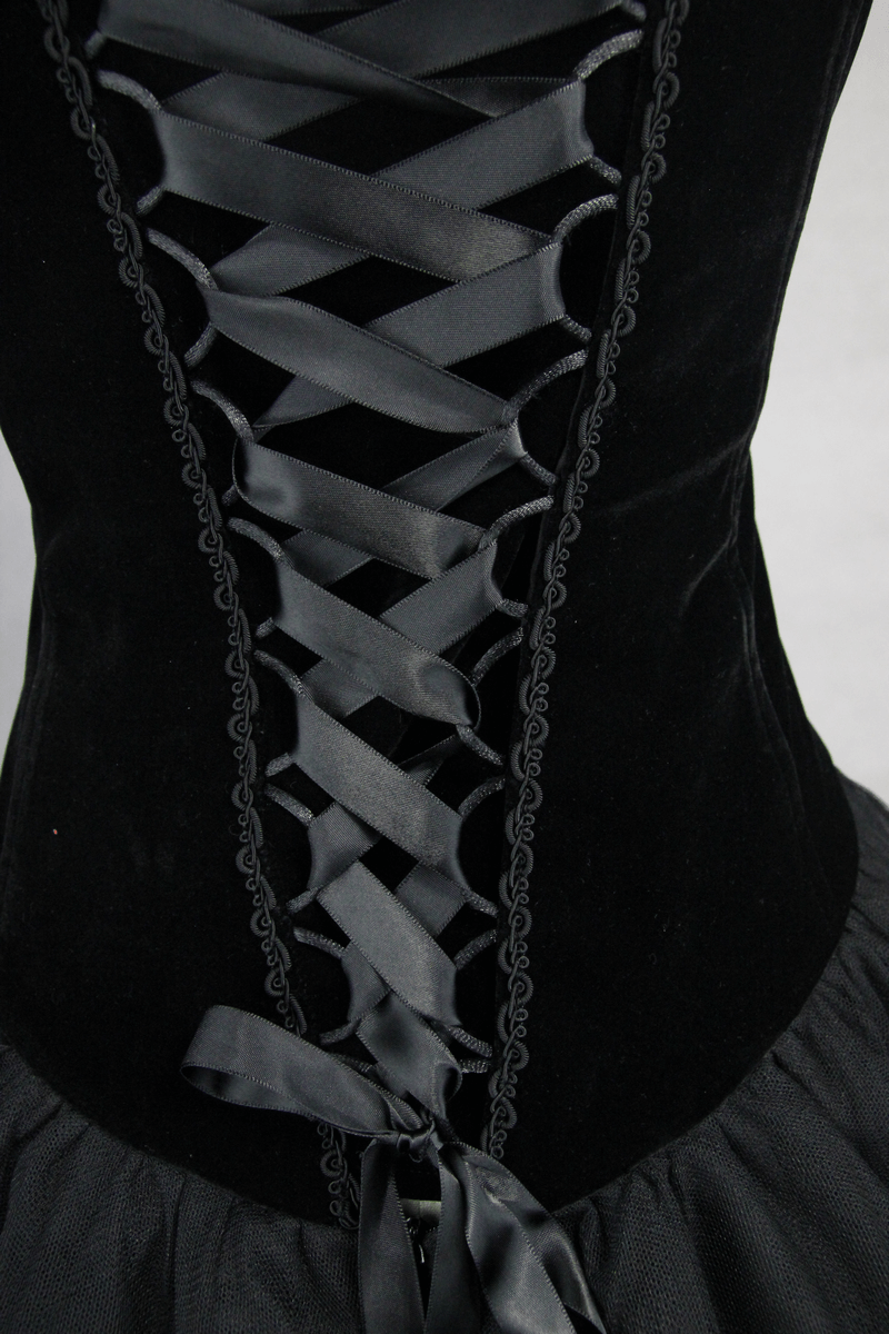 Close-up of the black strapless dress back showing intricate lace-up design with satin ribbons.