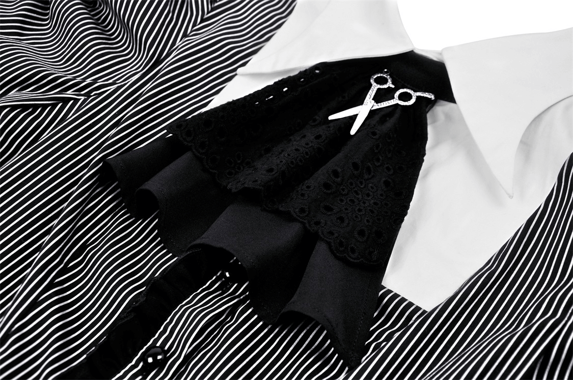 Steampunk striped dress with ruffled black sleeves and scissors brooch detail, perfect for chic events.