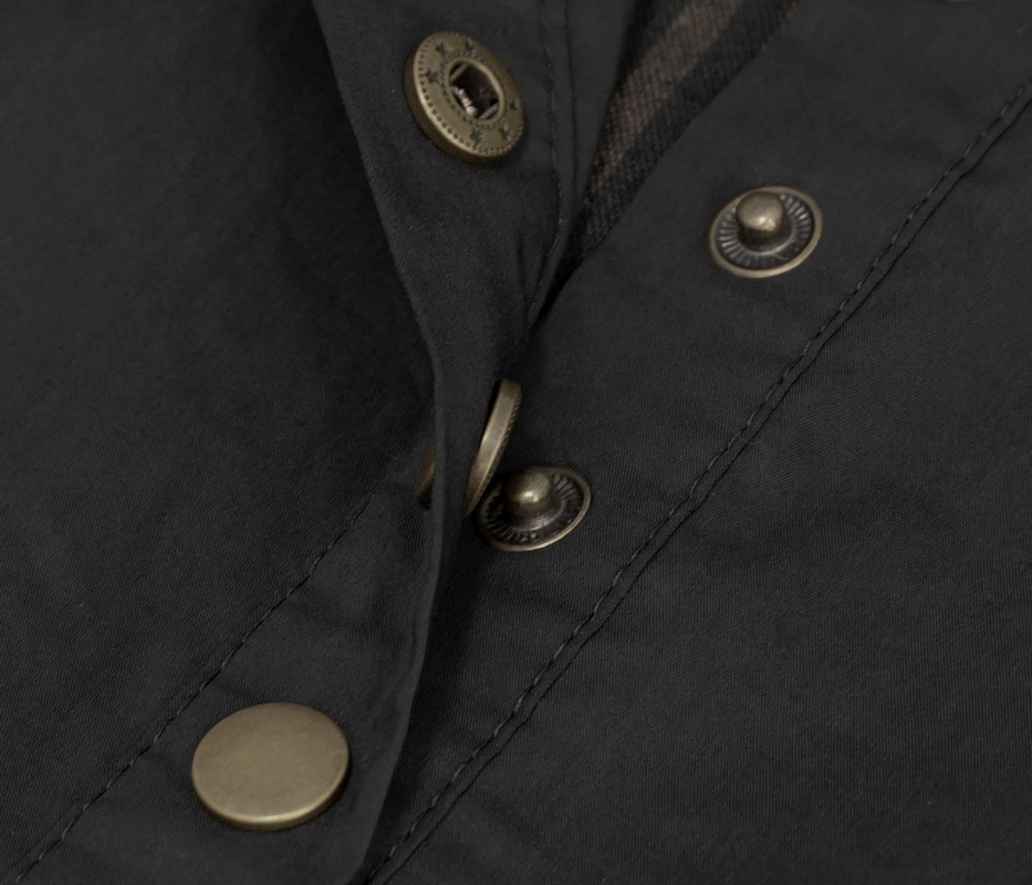 Close-up of vintage black shirt buttons for women's steampunk style blouse.