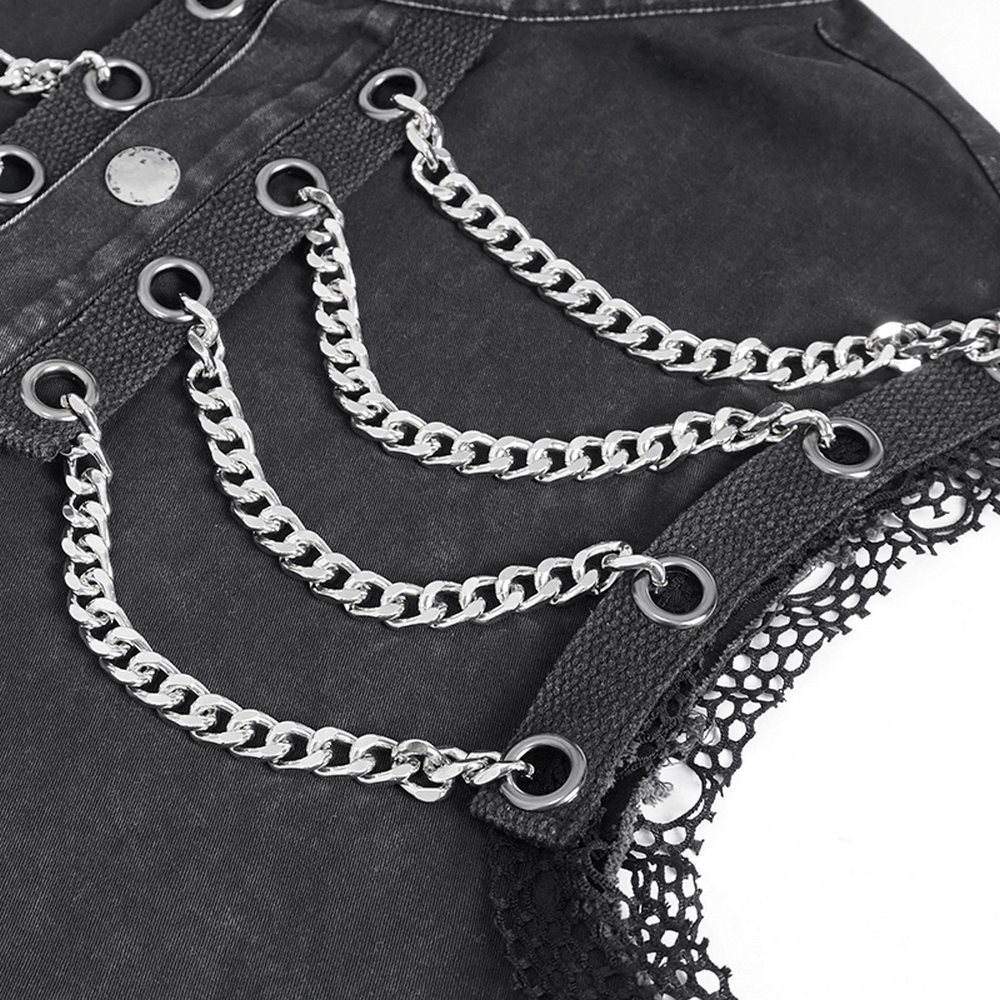 Close-up of steampunk black vest featuring silver chains and lace detailing, perfect for gothic fashion.