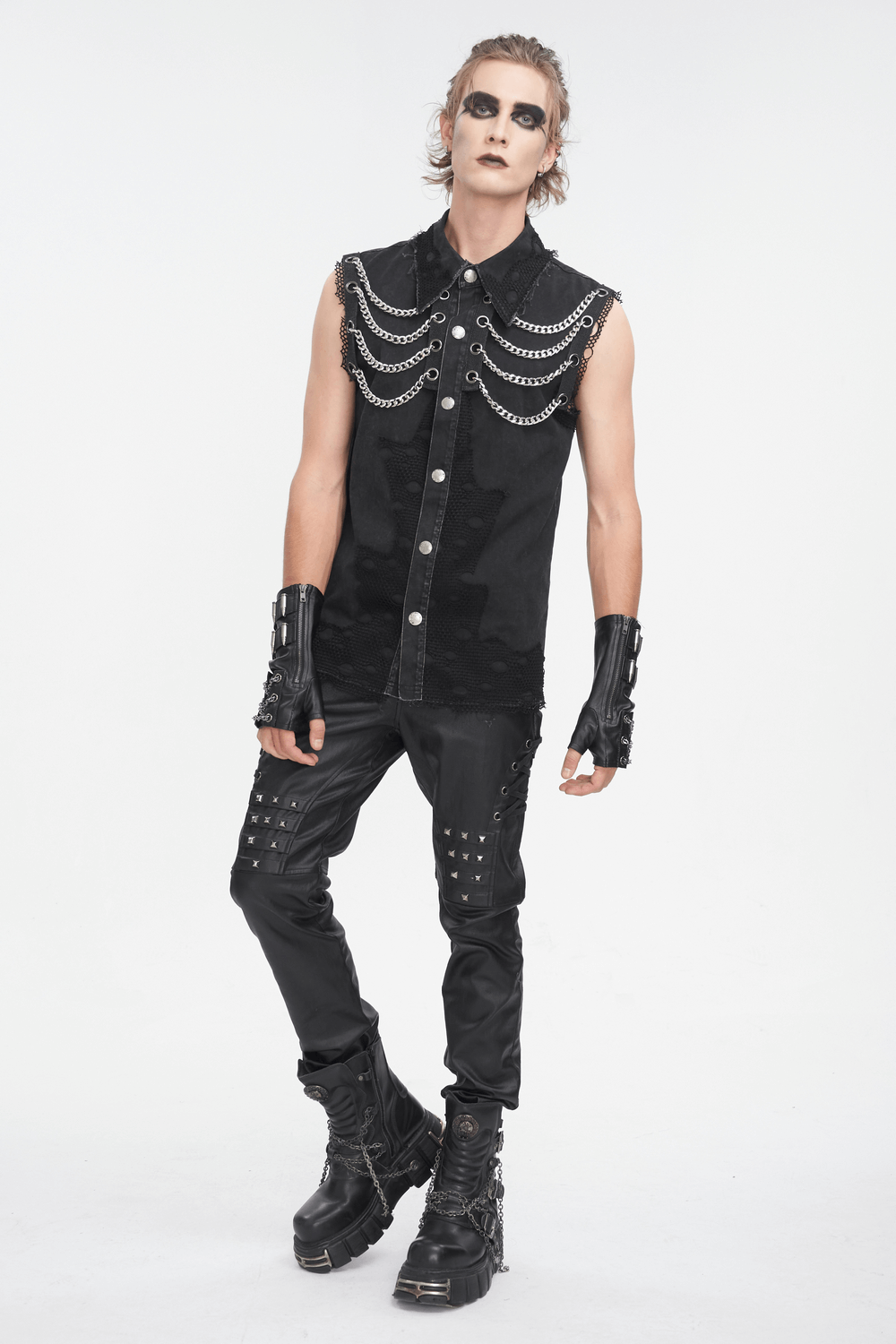 Edgy steampunk sleeveless black chain vest for men, styled with matching black pants and accessories.