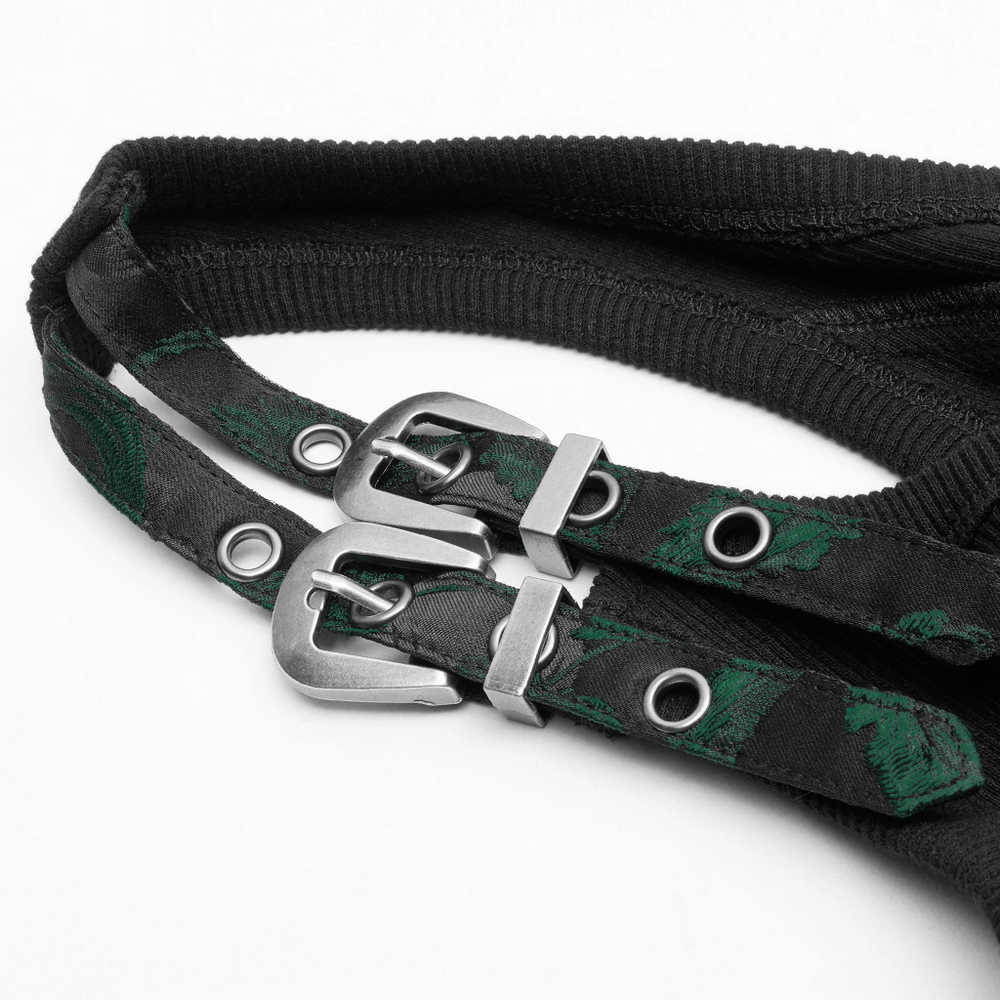 Close-up of black jacquard waistcoat shoulder straps with green vine pattern and silver buckles.