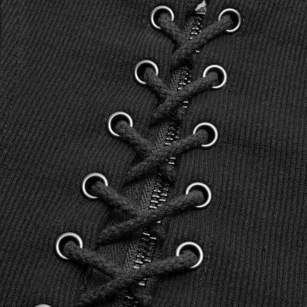 Close-up of black jacquard waistcoat lacing and zipper detail, featuring metal grommets for a steampunk look.