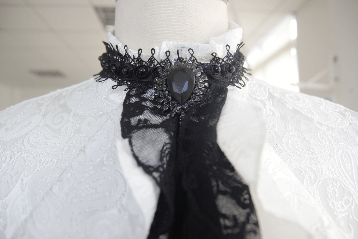 Steampunk white men's shirt close-up with elegant black tie collar and intricate lace detail.