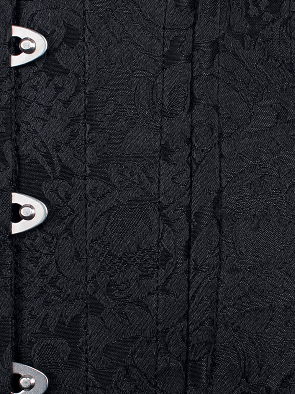 Close-up of the brocade fabric and metal clasps of a steel boned overbust corset.