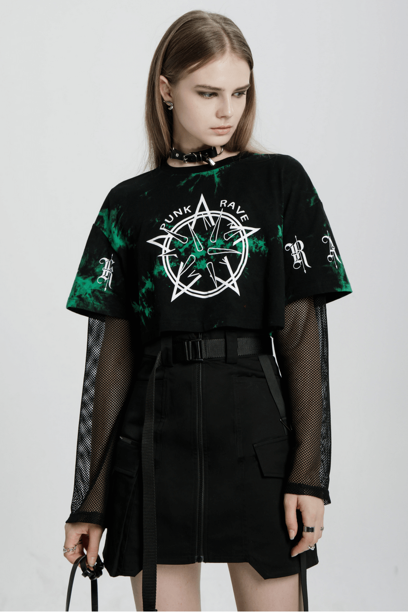 Model showcasing an edgy asymmetric high waist tactical skirt with a punk graphic tee and mesh sleeves.