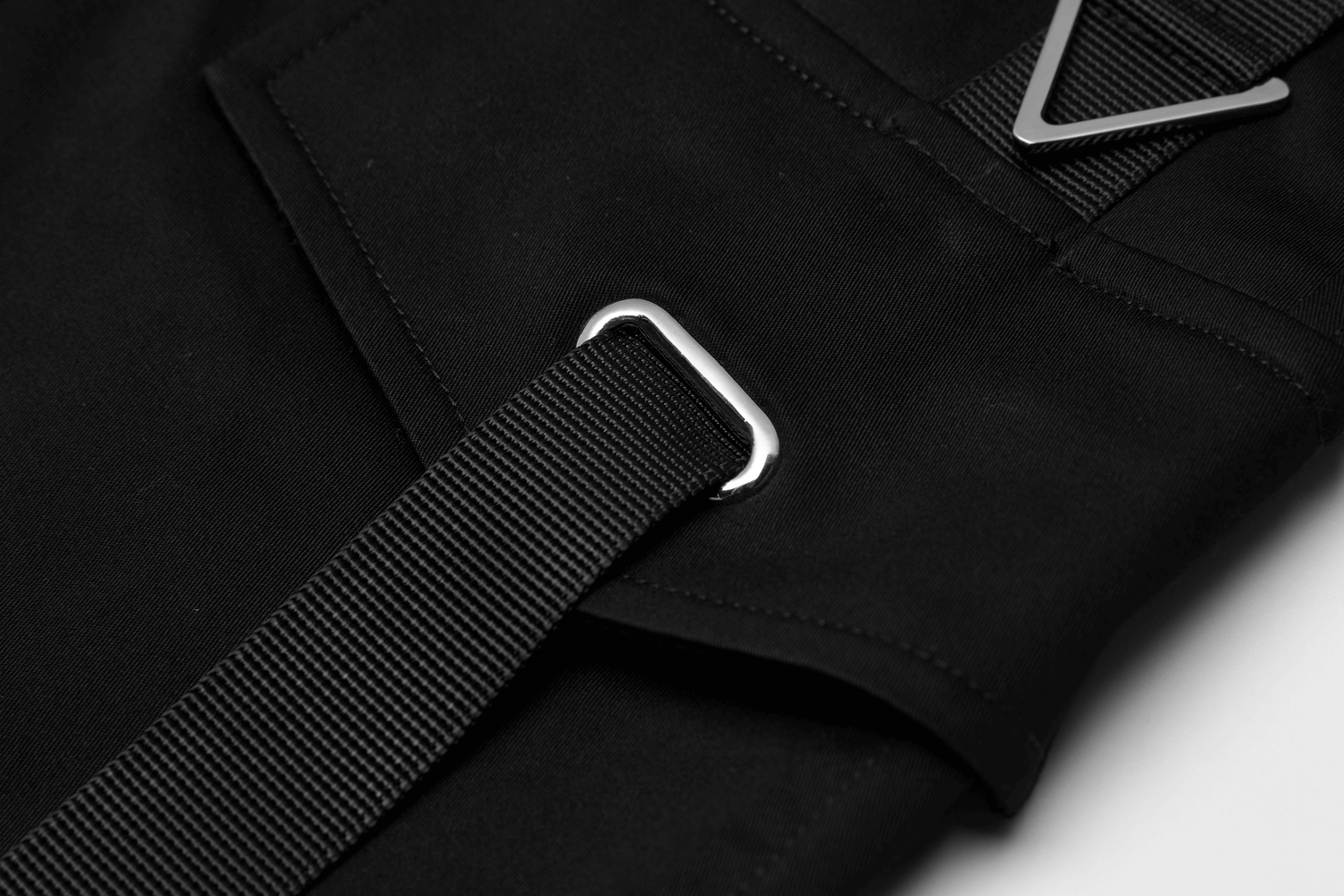 Close-up of the edgy tactical skirt's durable fabric and stylish customizable belt detail.
