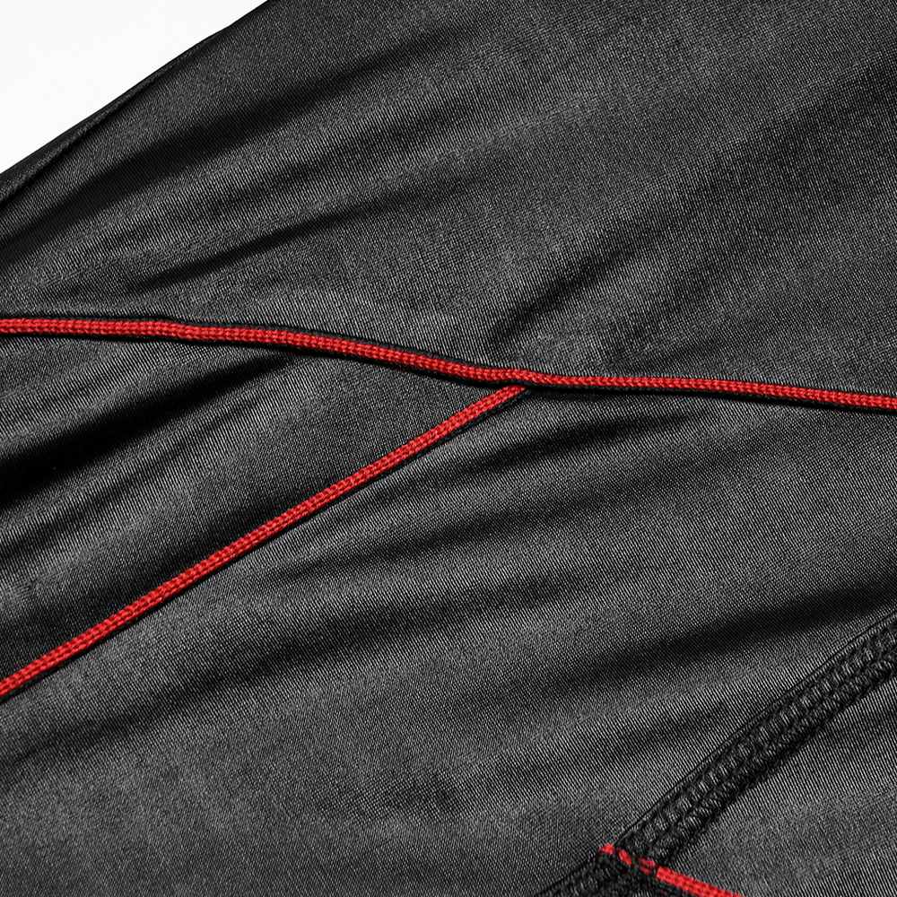 Close-up view of stretch faux leather pants showcasing chic red contrast stitching detail.