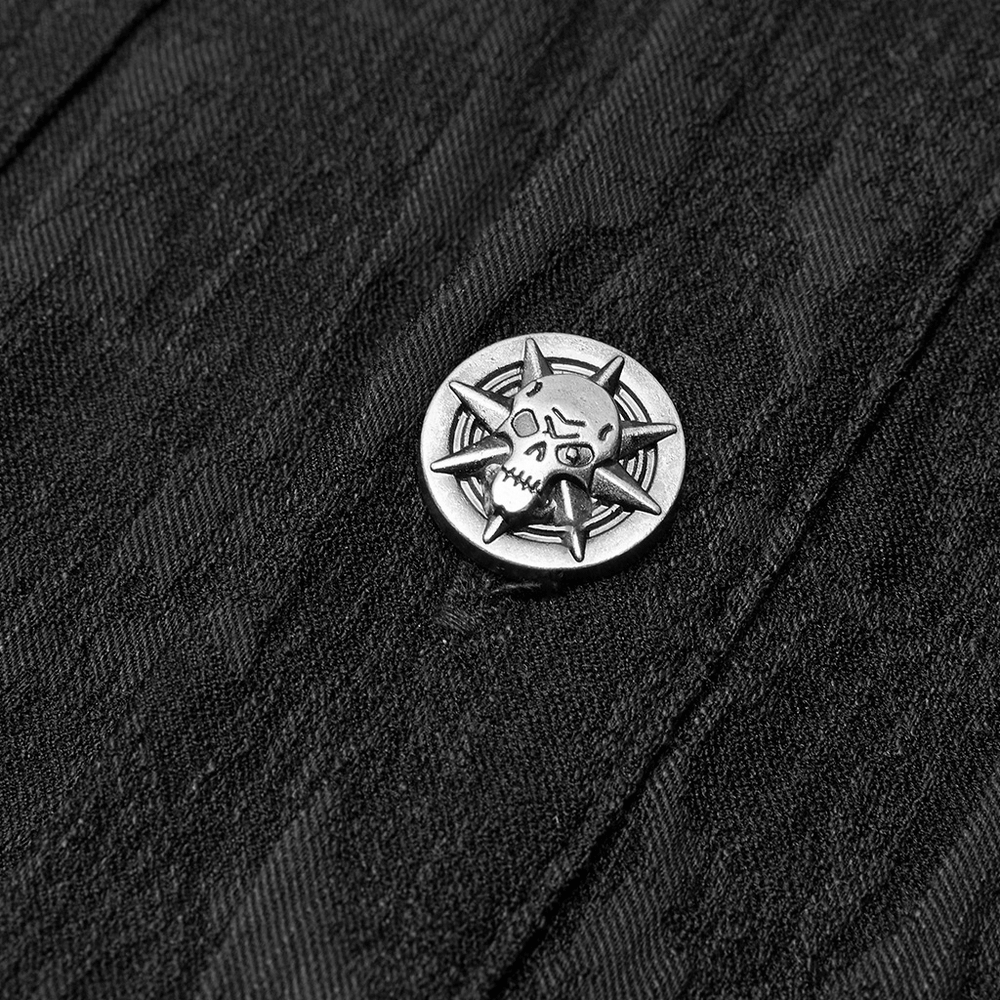 Close-up of a unique skull and spikes button detail on a black stretch jacquard shirt.