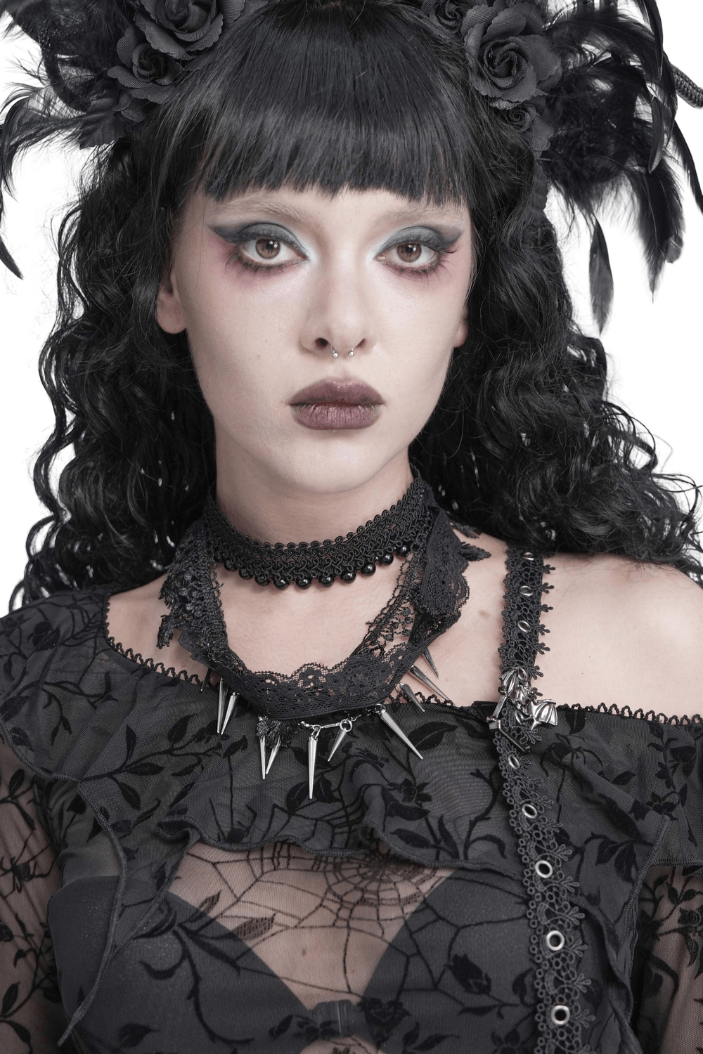 Striking Lace Choker Necklace with Spikes and Cross Charms worn by a model showcasing gothic elegance.