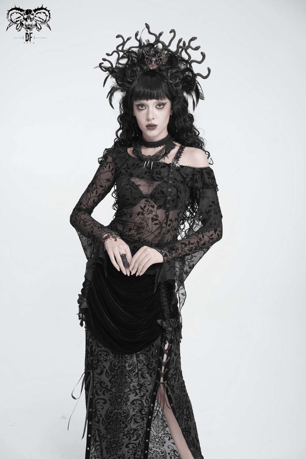 Striking Lace Choker Necklace with Spikes and Cross Charms worn by a model in gothic attire.
