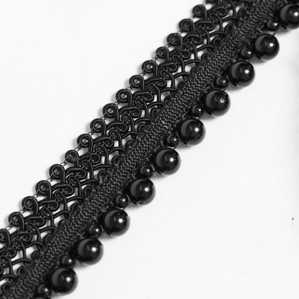 Close-up of black lace and beaded details on the Striking Lace Choker Necklace with Spikes and Cross Charms.