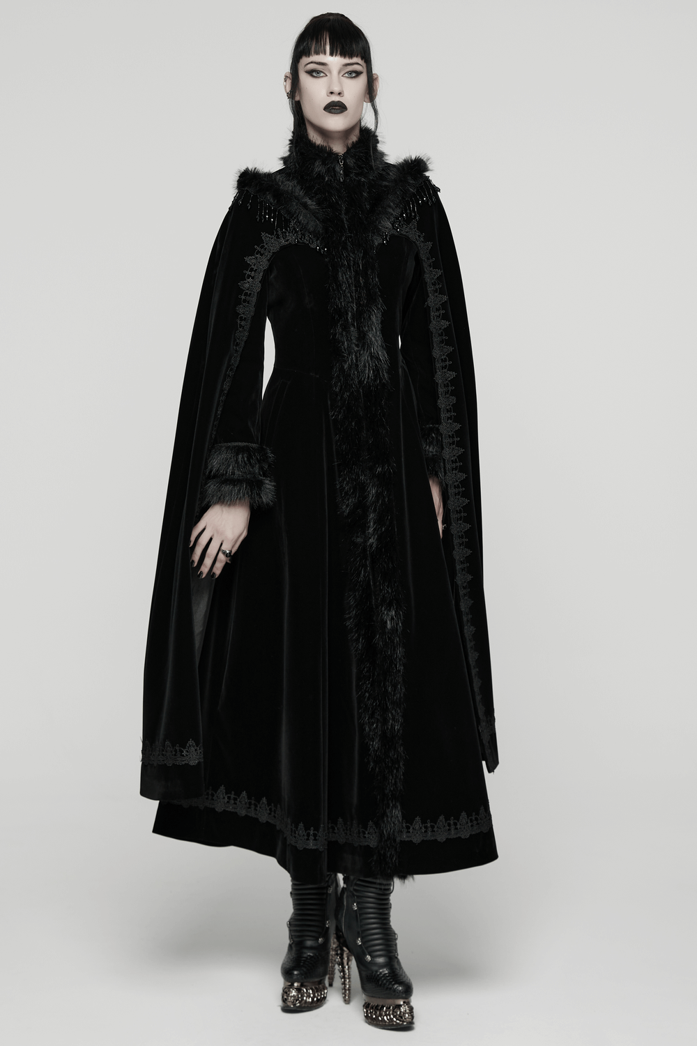 Striking Velvet Cloak Coat with Fur Trim and Tassel Chains worn by a model, showcasing gothic elegance and intricate design.