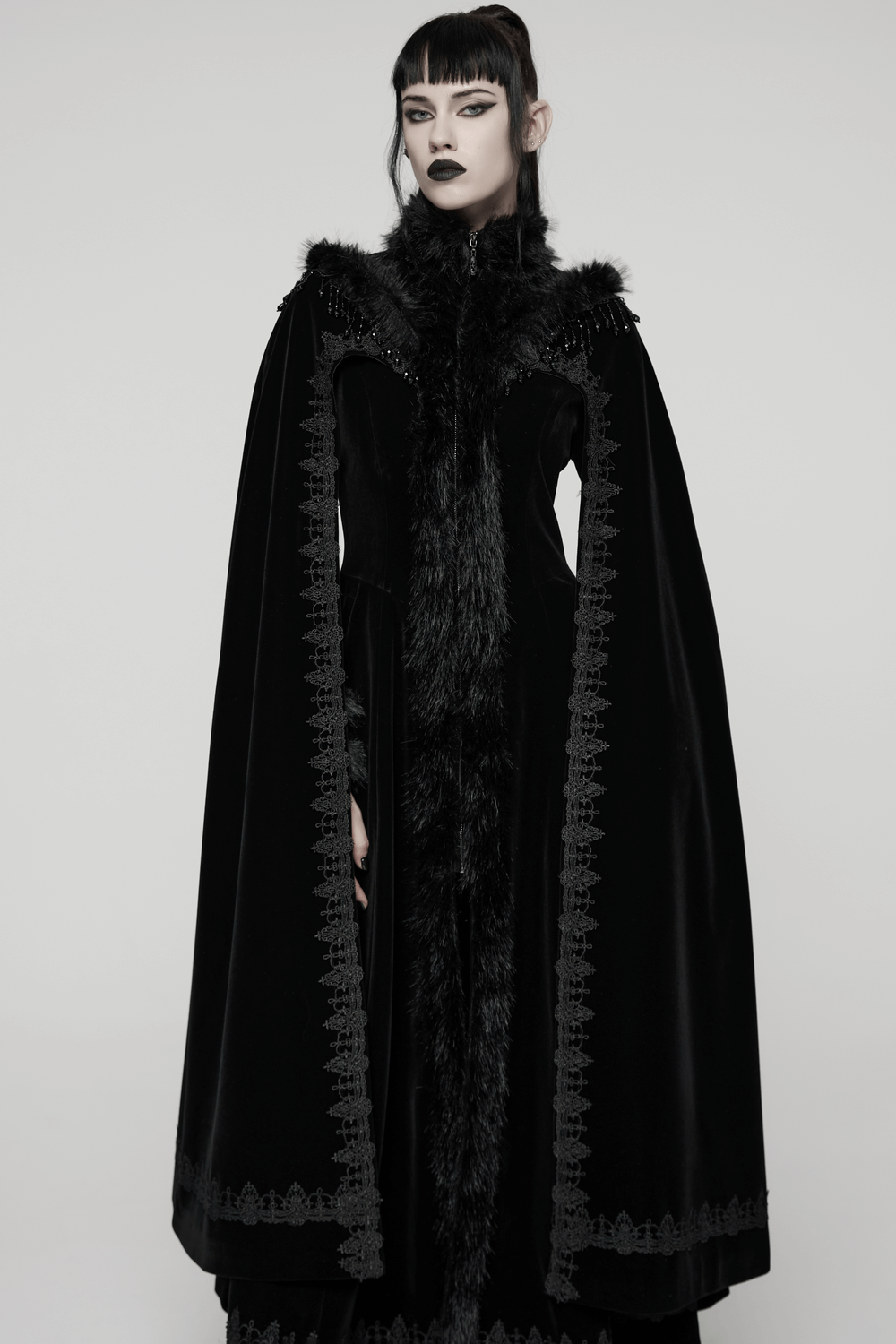 Striking Velvet Cloak Coat with Fur Trim and Tassel Chains showcasing gothic elegance and plush texture.