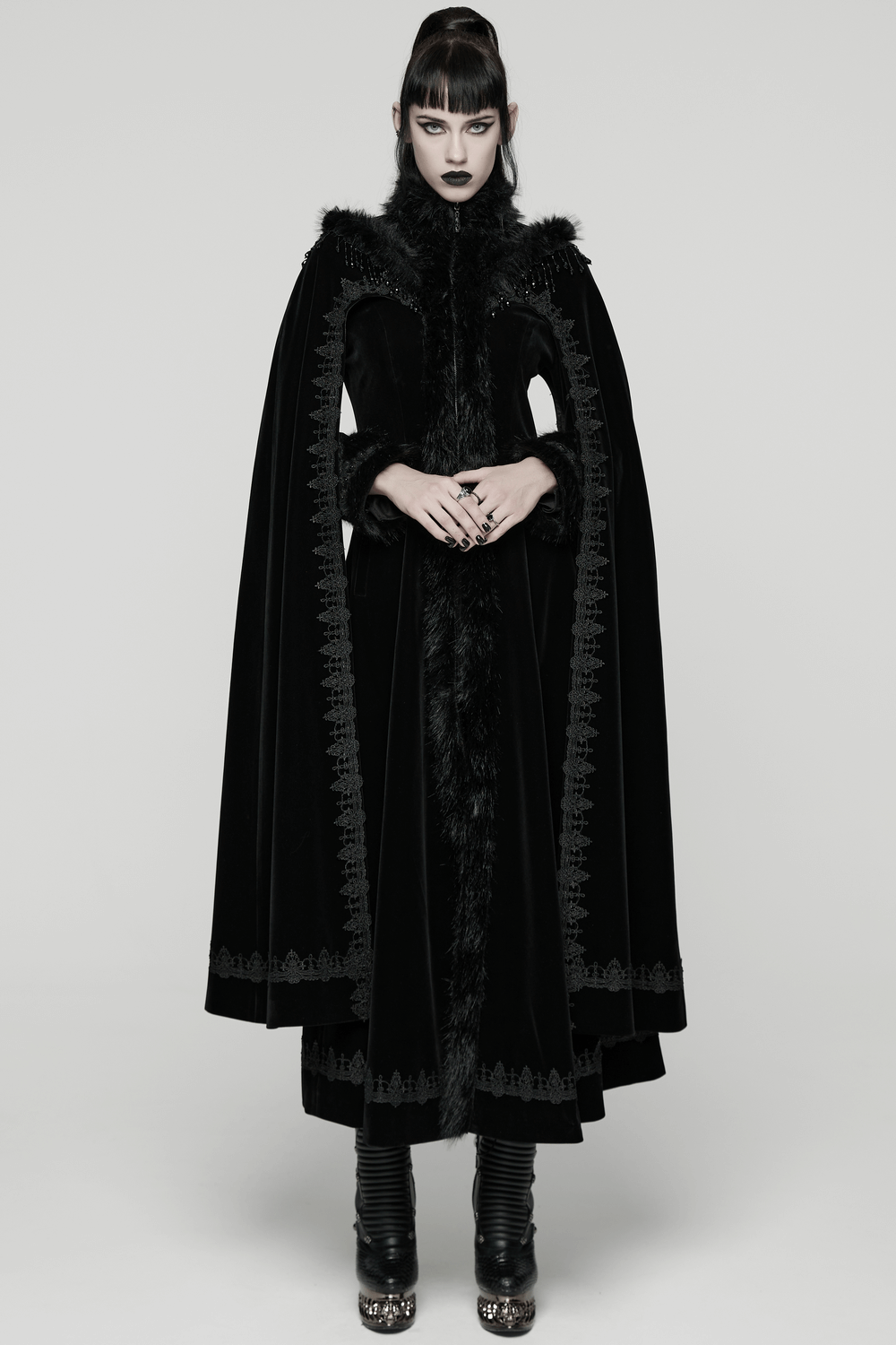 Striking Velvet Cloak Coat with Fur Trim and Tassel Chains worn by a model, showcasing gothic elegance and intricate design.