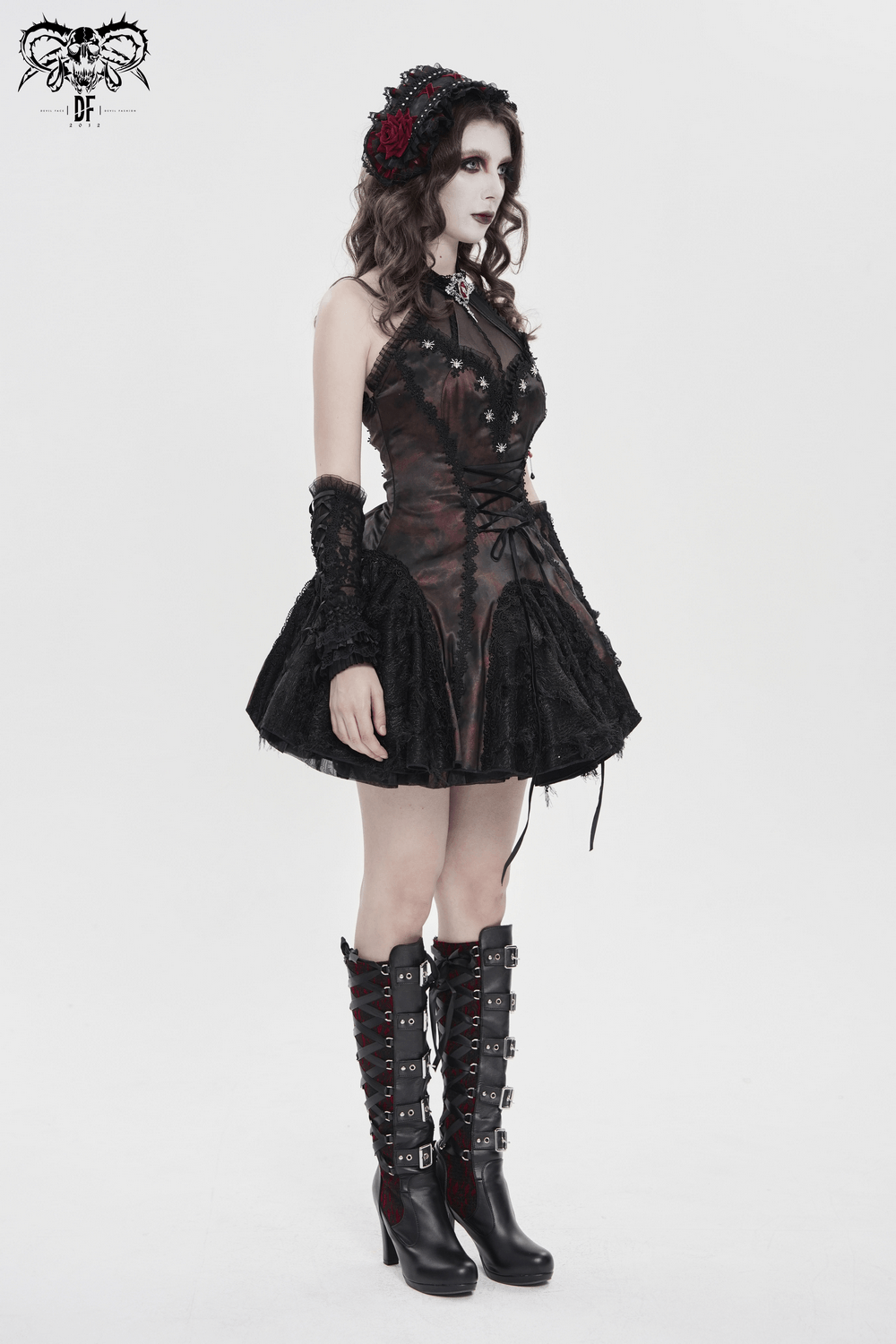 Striking Women's Halter Mini Dress with Corset Lacing Detail worn by a model with gothic accessories.