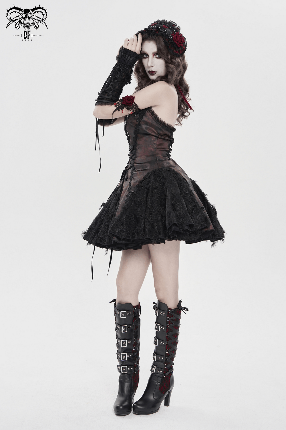 Striking Women's Halter Mini Dress with Corset Lacing Detail showcased on model with gothic accessories and dramatic styling.