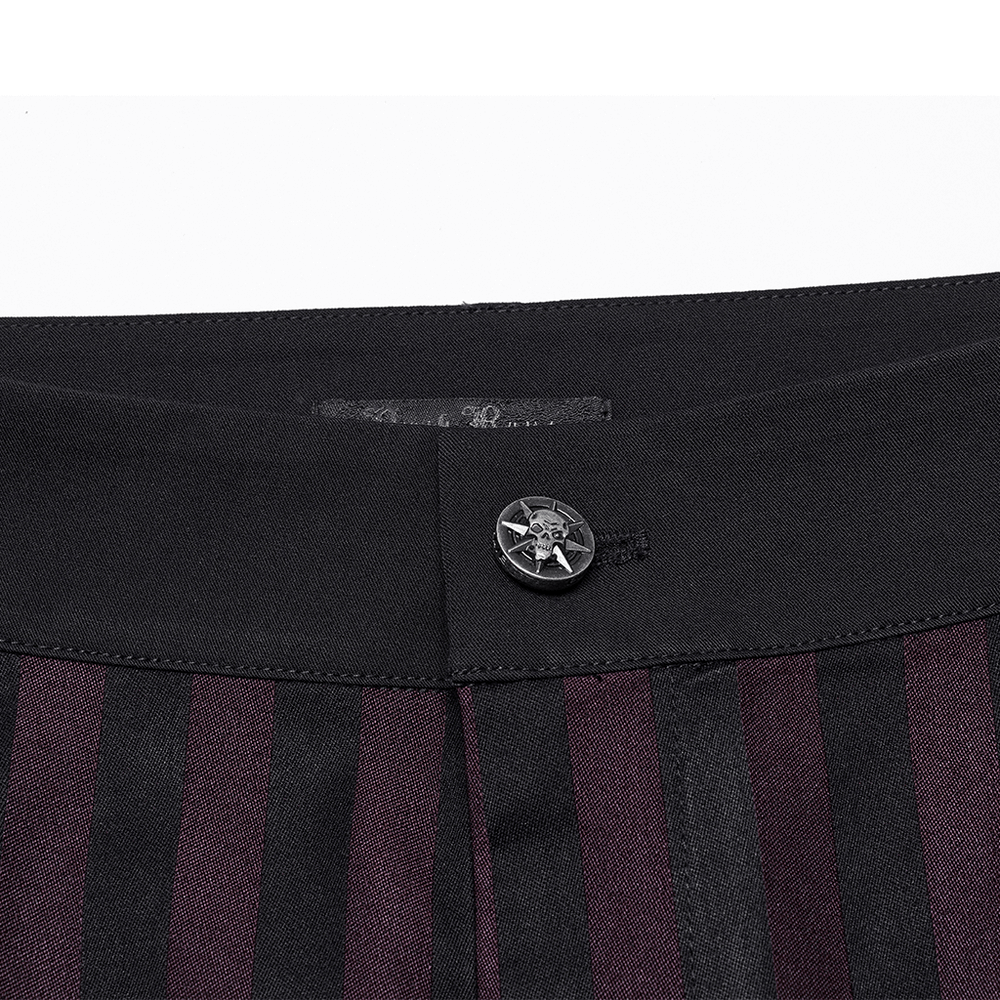 Close-up of striped black and burgundy slim gothic trousers waistband with button detail.